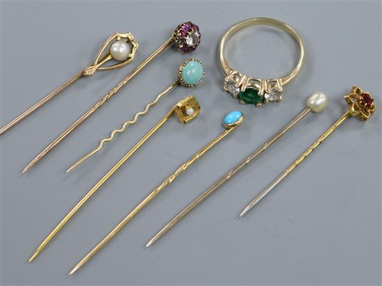 A 585 yellow metal ring and seven assorted stick pins including one 10ct.